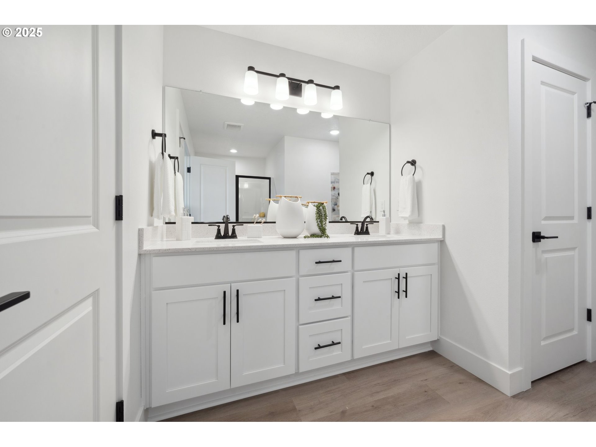 19885 Southwest Lou Lane, Unit L23 Beaverton, OR 97007 - Photo 19 of 30 a bathroom with a double vanity sink mirror and