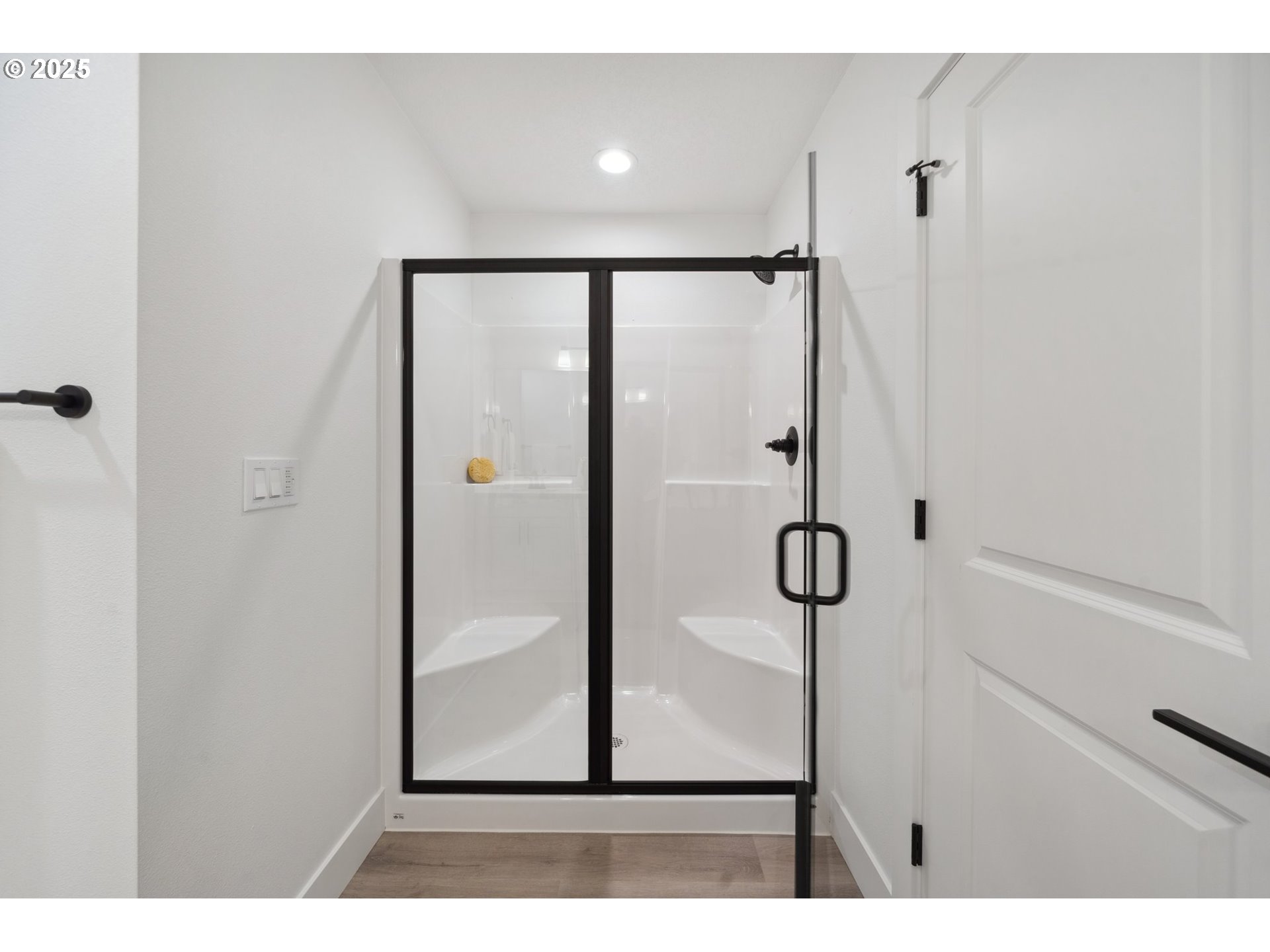 19885 Southwest Lou Lane, Unit L23 Beaverton, OR 97007 - Photo 20 of 30 a bathroom with a glass shower door