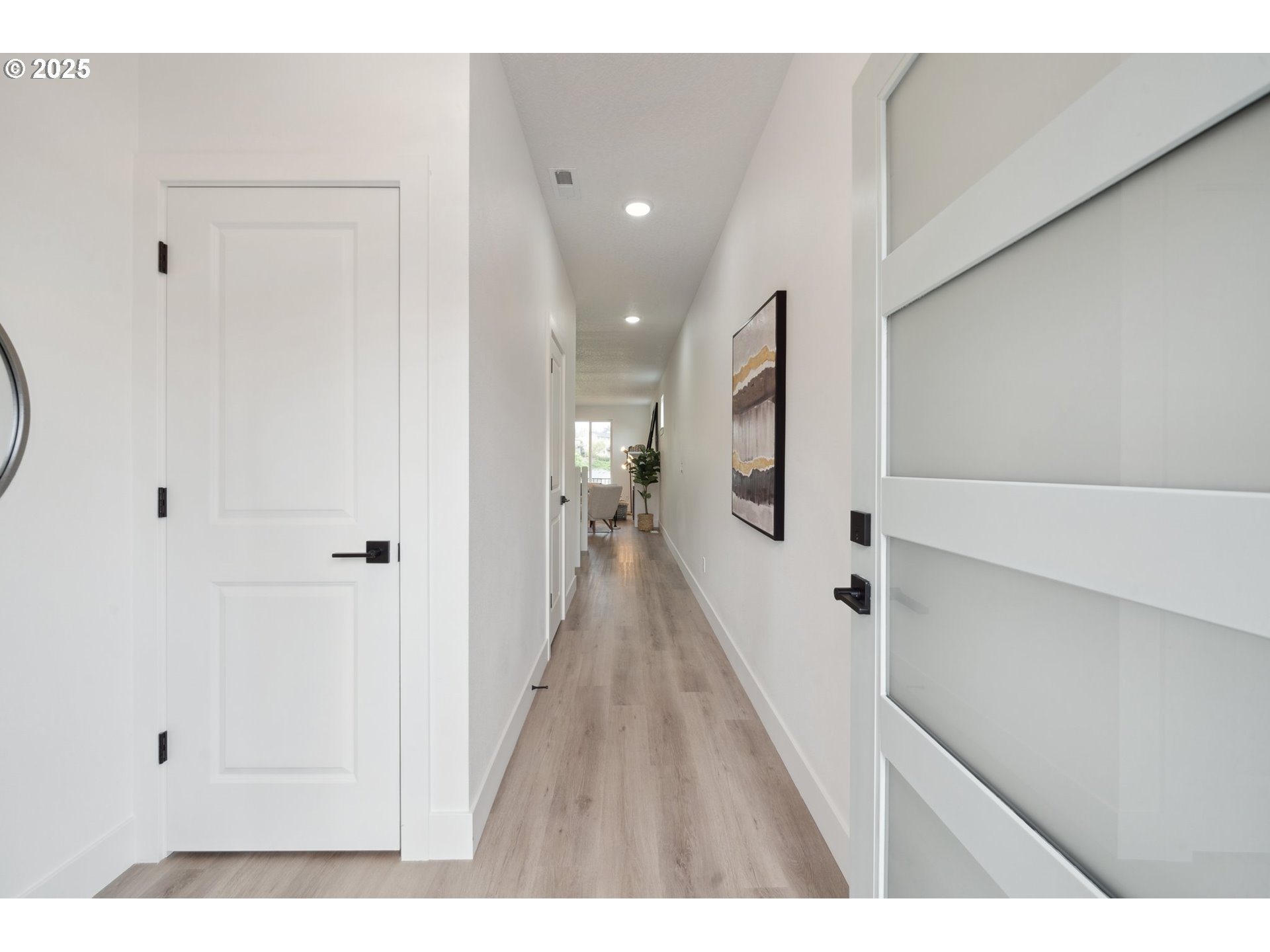 19885 Southwest Lou Lane, Unit L23 Beaverton, OR 97007 - Photo 2 of 30 a view of a hallway with a white walls