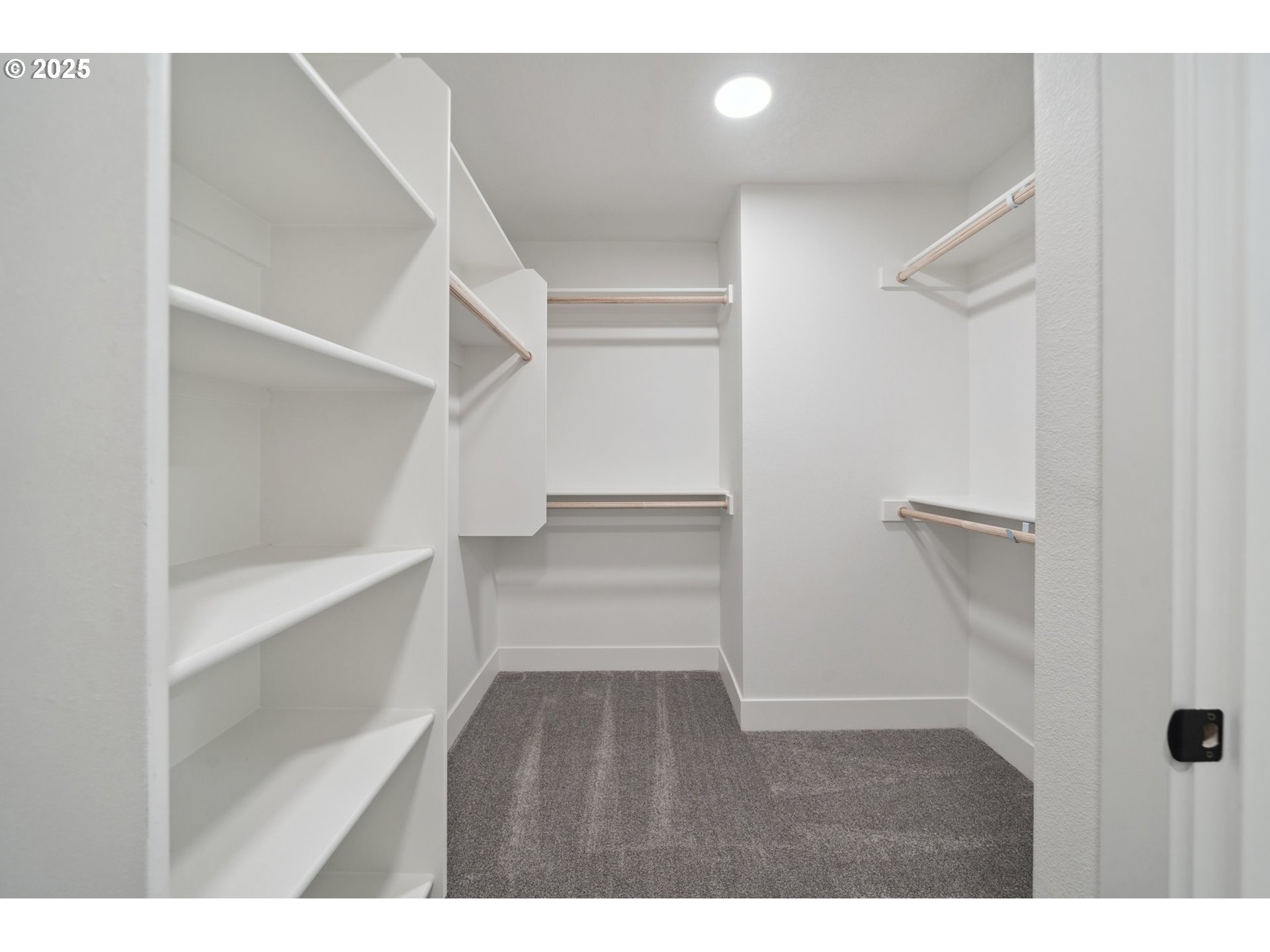 19885 Southwest Lou Lane, Unit L23 Beaverton, OR 97007 - Photo 21 of 30 a view of an empty walk in closet