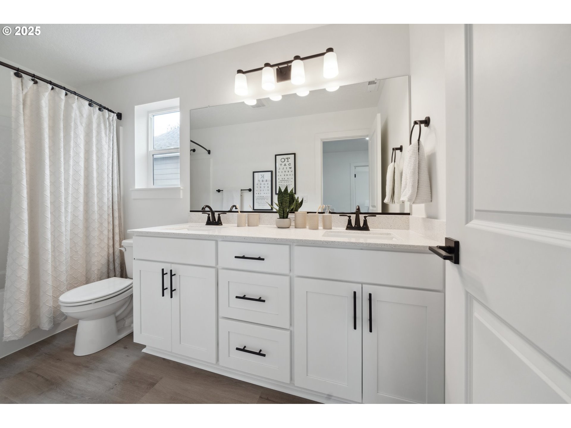 19885 Southwest Lou Lane, Unit L23 Beaverton, OR 97007 - Photo 23 of 30 a bathroom with a double vanity sink mirror and toilet