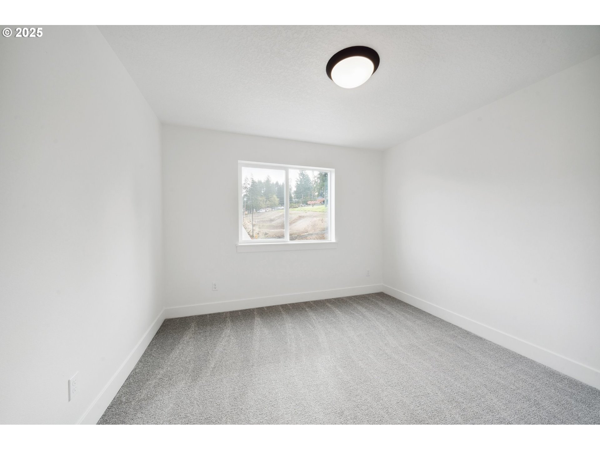 19885 Southwest Lou Lane, Unit L23 Beaverton, OR 97007 - Photo 26 of 30 a view of an empty room with a window