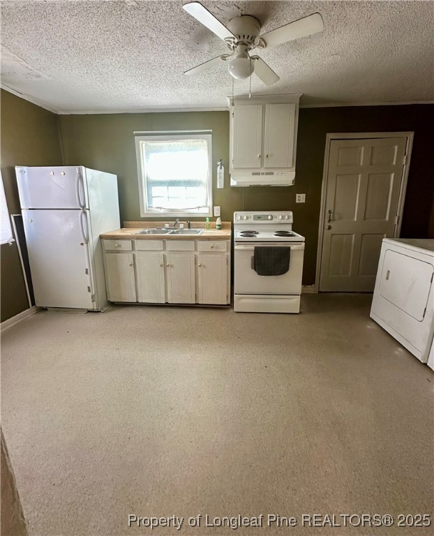 400 Daniel McLeod Road Red Springs, NC 28377 - Photo 9 of 12 a kitchen with a white cabinets and white appliances