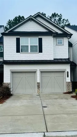 a front view of a house with a garage