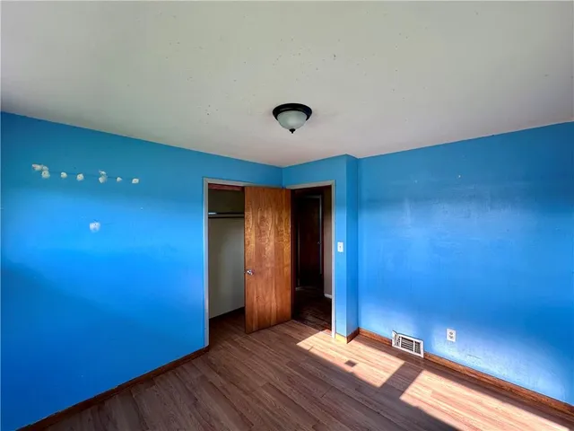 a view of gallery with wooden floor