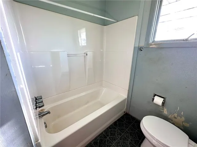 a bathroom with a sink a toilet and a bathtub