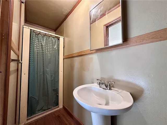 a bathroom with a sink and a mirror