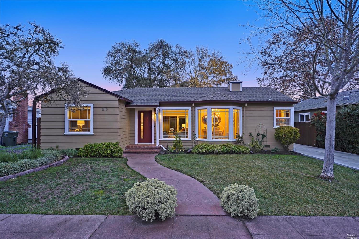 510 Rosedale Avenue Santa Rosa, CA 95405 - Photo 1 of 1 a view of a brick house with a big yard and large trees