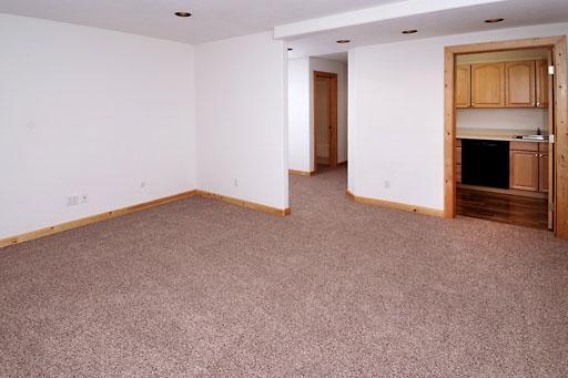 11 Hackamore Road, Unit B Edwards, CO 81632 - Photo 15 of 20 an empty room with a fireplace and a window