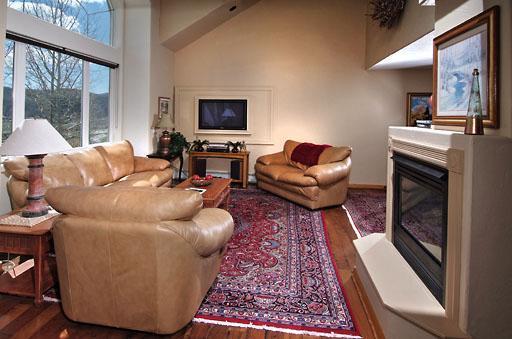 11 Hackamore Road, Unit B Edwards, CO 81632 - Photo 5 of 20 a living room with furniture and a fireplace