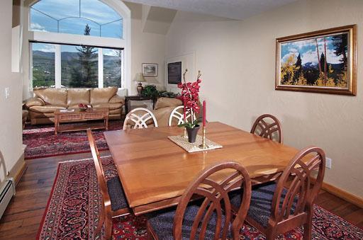 11 Hackamore Road, Unit B Edwards, CO 81632 - Photo 6 of 20 a view of a dining room with furniture window and wooden floor