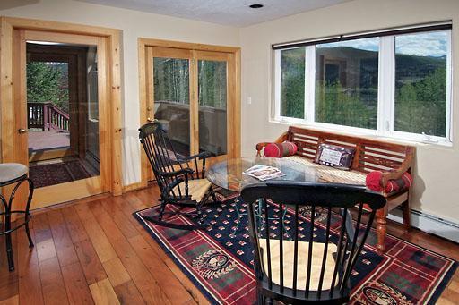 11 Hackamore Road, Unit B Edwards, CO 81632 - Photo 7 of 20 a view of deck with table and chairs couches with wooden floor