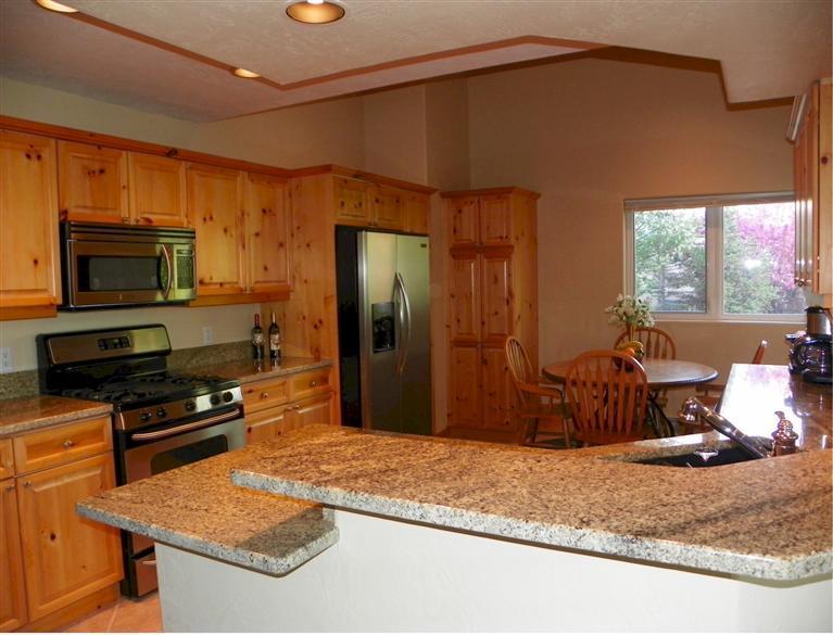 11 Hackamore Road, Unit B Edwards, CO 81632 - Photo 8 of 20 a kitchen with stainless steel appliances granite countertop a sink stove and refrigerator
