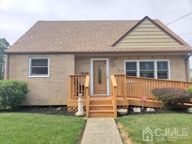 16 Rodney Road East Brunswick, NJ 08816 - Photo 1 of 12 a front view of a house with a garden