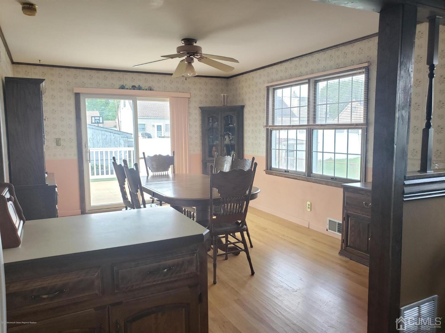 16 Rodney Road East Brunswick, NJ 08816 - Photo 3 of 12 a view of a dining room with furniture window and wooden floor