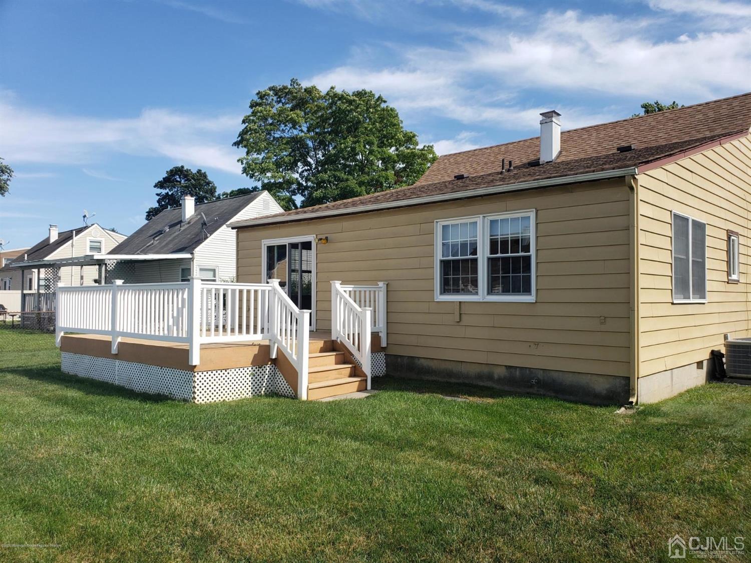 16 Rodney Road East Brunswick, NJ 08816 - Photo 4 of 12 front view of a house with a yard