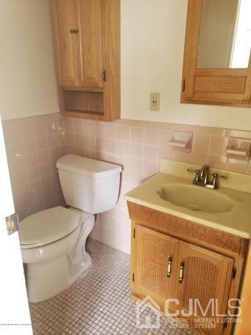 16 Rodney Road East Brunswick, NJ 08816 - Photo 7 of 12 a bathroom with a sink and a toilet