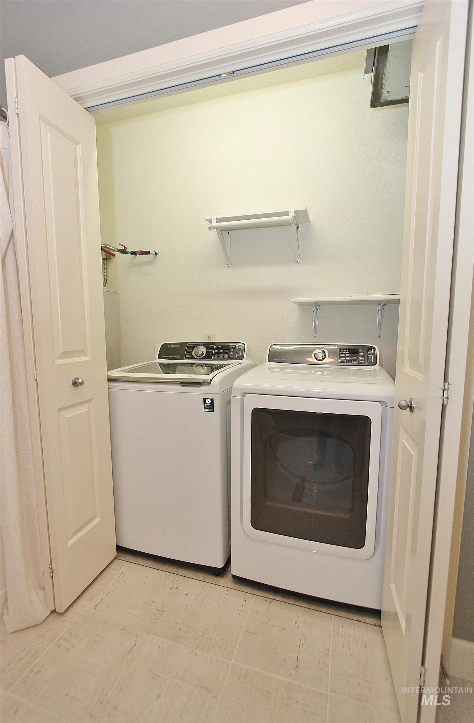 406 South 13th Street, Unit 303 Boise, ID 83702 - Photo 13 of 18 Laundry area with separate washer and dryer in closet off of bathroom