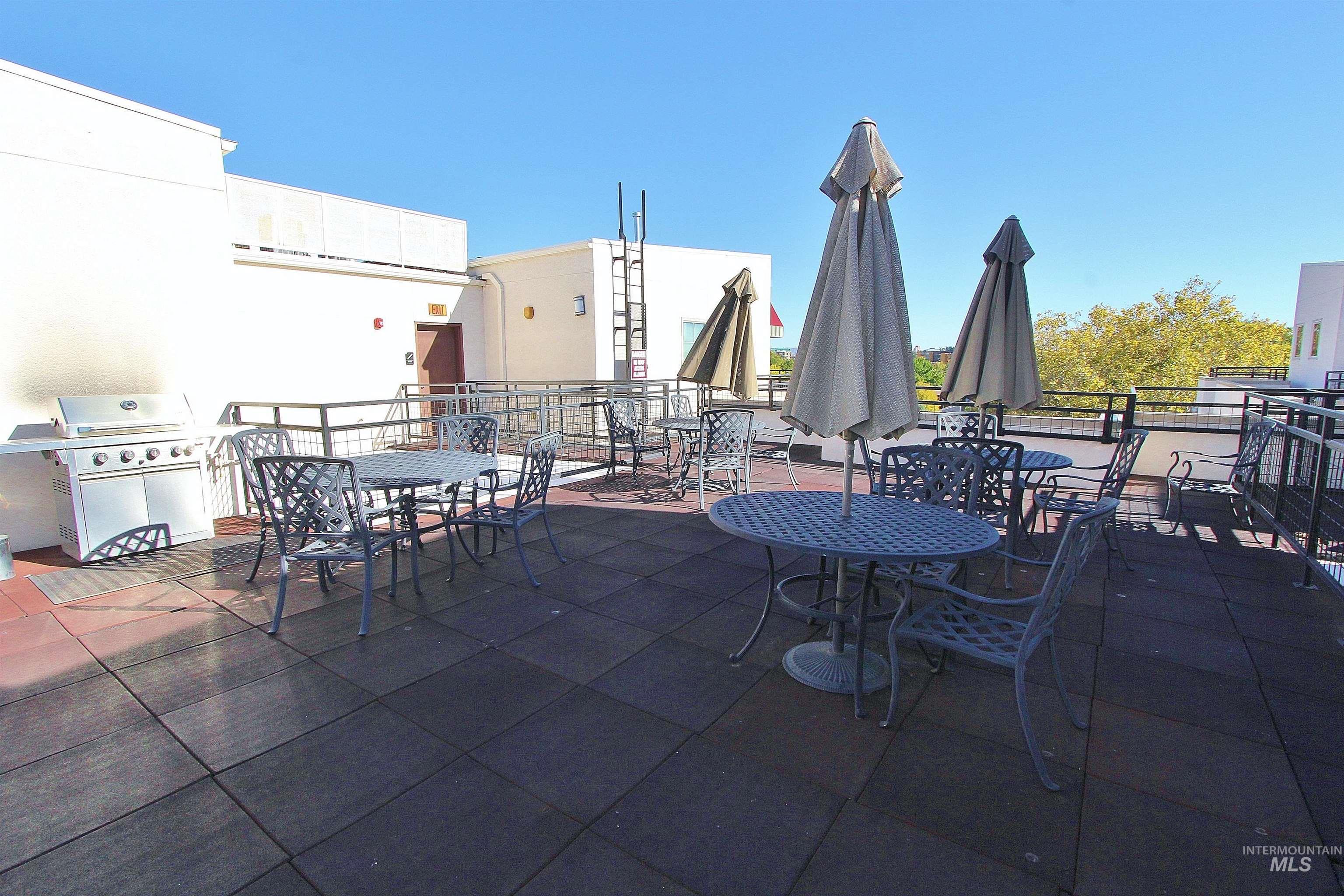 406 South 13th Street, Unit 303 Boise, ID 83702 - Photo 16 of 18 View of patio featuring outdoor dining space and a grill