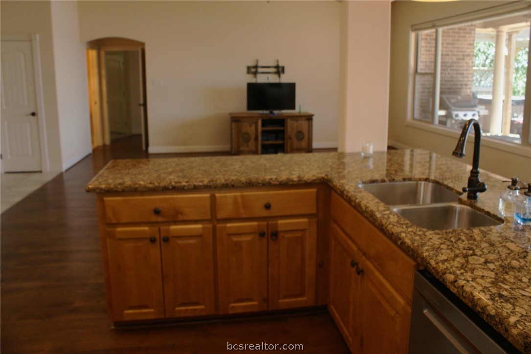 259 Memphis Bell Lane Trinity, TX 75862 - Photo 13 of 50 a kitchen with granite countertop a sink and a granite counter tops