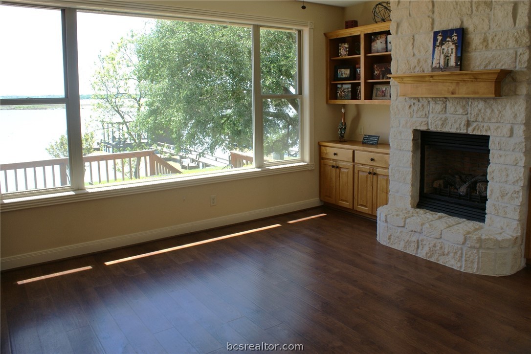 259 Memphis Bell Lane Trinity, TX 75862 - Photo 17 of 50 a view of an empty room with wooden floor and a window