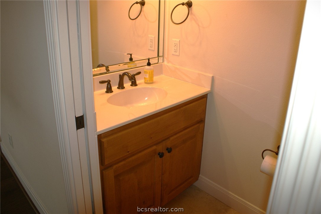 259 Memphis Bell Lane Trinity, TX 75862 - Photo 18 of 50 a bathroom with a sink and a mirror