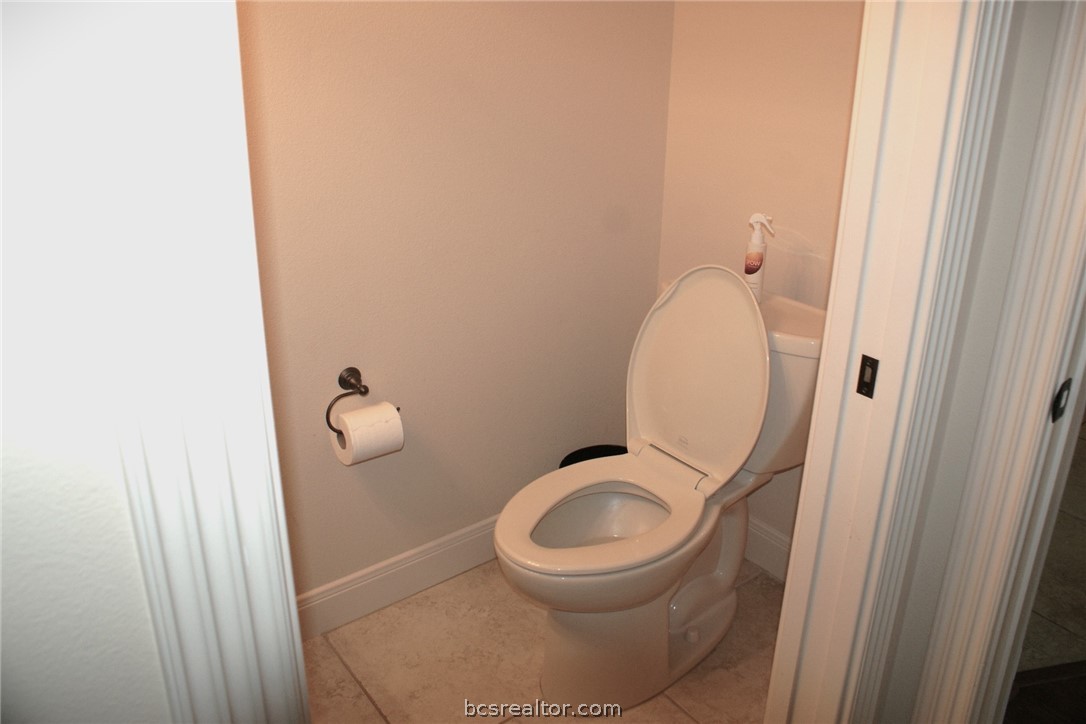 259 Memphis Bell Lane Trinity, TX 75862 - Photo 19 of 50 a bathroom with a granite countertop toilet and a sink