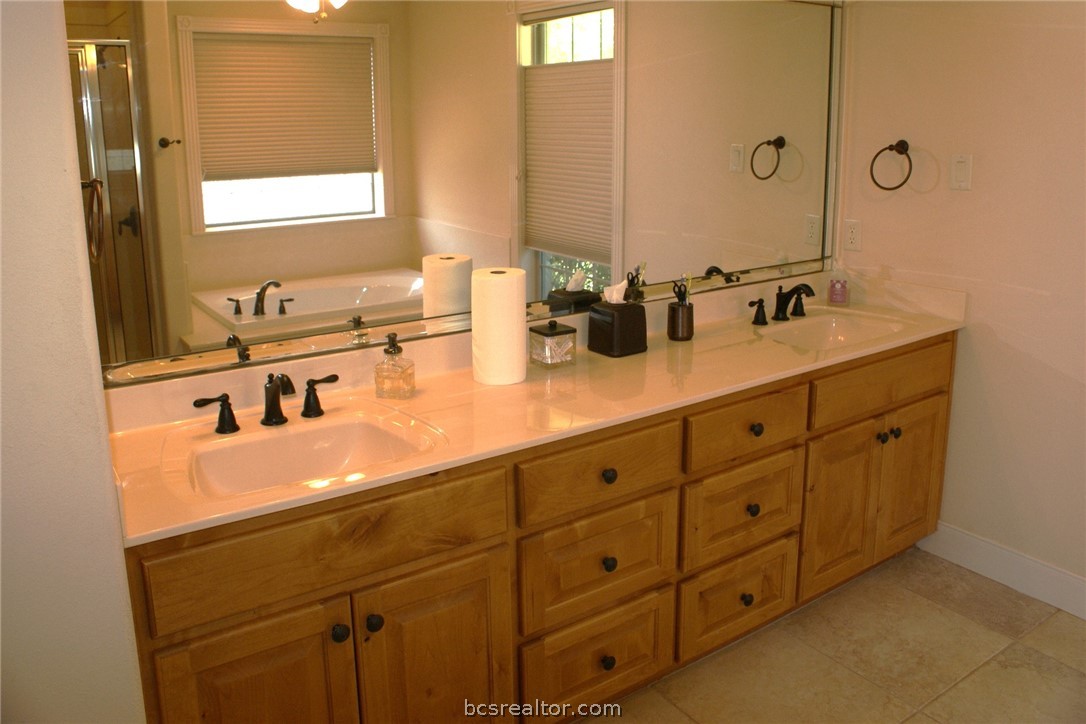 259 Memphis Bell Lane Trinity, TX 75862 - Photo 22 of 50 a bathroom with a sink and a mirror