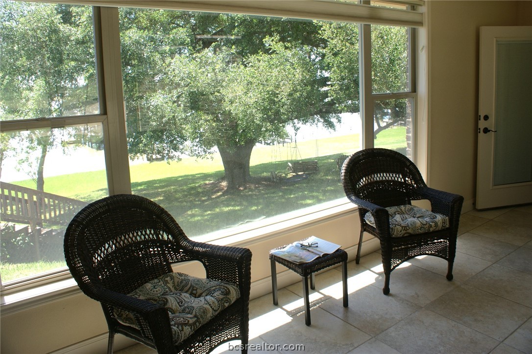 259 Memphis Bell Lane Trinity, TX 75862 - Photo 27 of 50 a living room filled with furniture and a floor to ceiling window