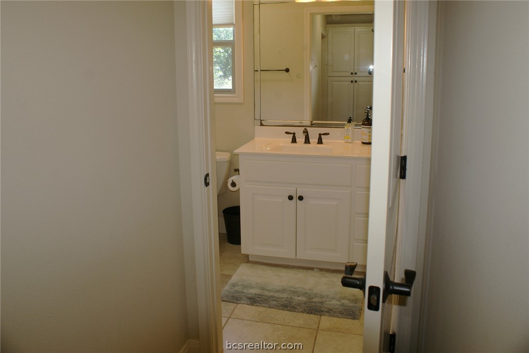 259 Memphis Bell Lane Trinity, TX 75862 - Photo 30 of 50 a bathroom with a sink and mirror