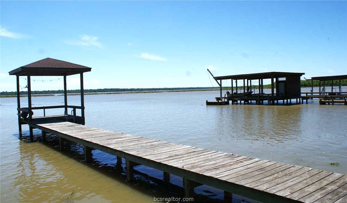 259 Memphis Bell Lane Trinity, TX 75862 - Photo 34 of 50 a view of a roof deck with chair and potted plants