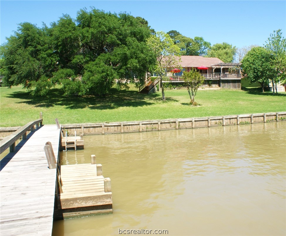 259 Memphis Bell Lane Trinity, TX 75862 - Photo 43 of 50 a view of a lake with a house