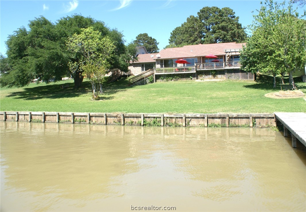 259 Memphis Bell Lane Trinity, TX 75862 - Photo 44 of 50 a swimming pool with outdoor seating and yard