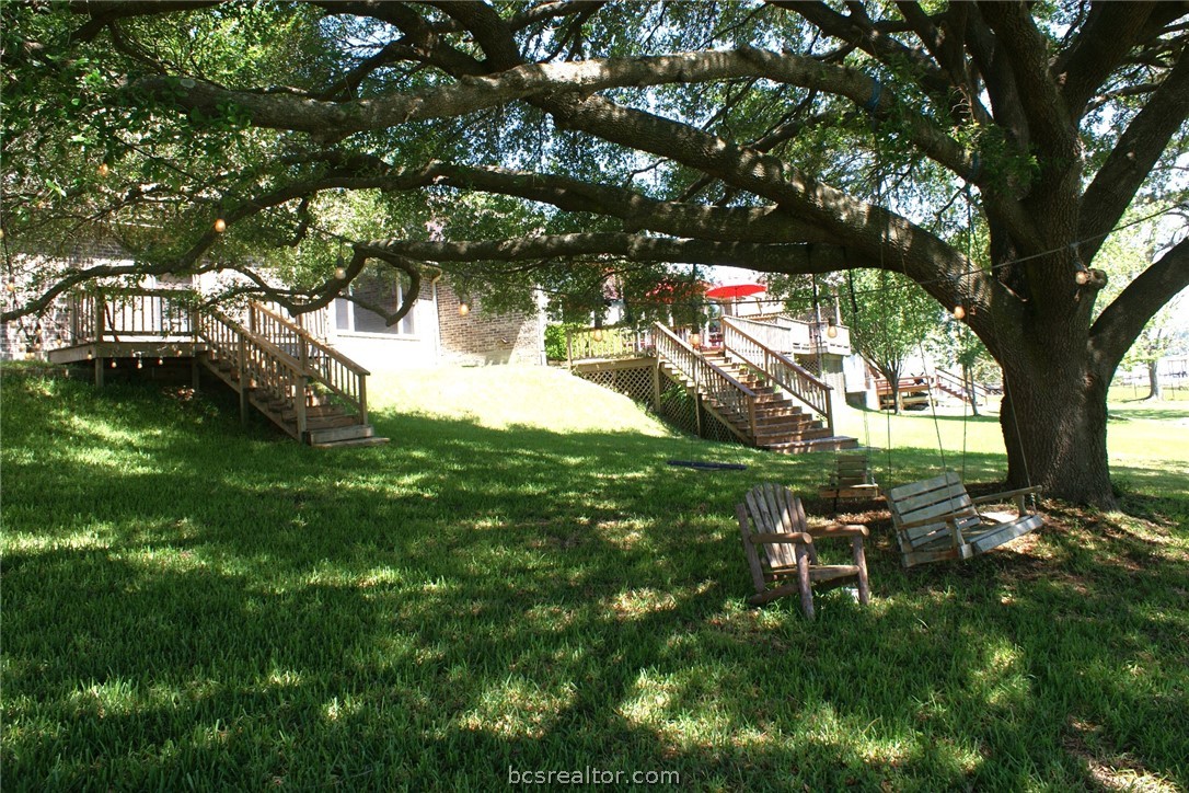 259 Memphis Bell Lane Trinity, TX 75862 - Photo 45 of 50 a backyard of a house with table and chairs