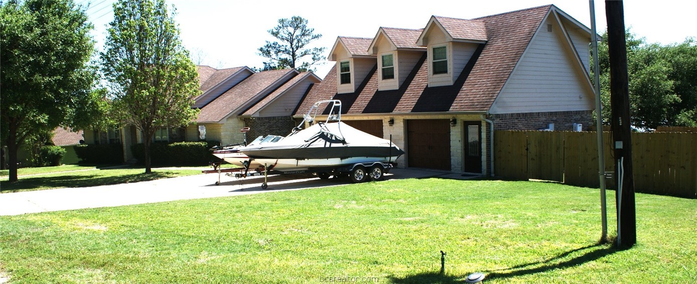 259 Memphis Bell Lane Trinity, TX 75862 - Photo 5 of 50 a view of a lounge chairs in back yard of the house