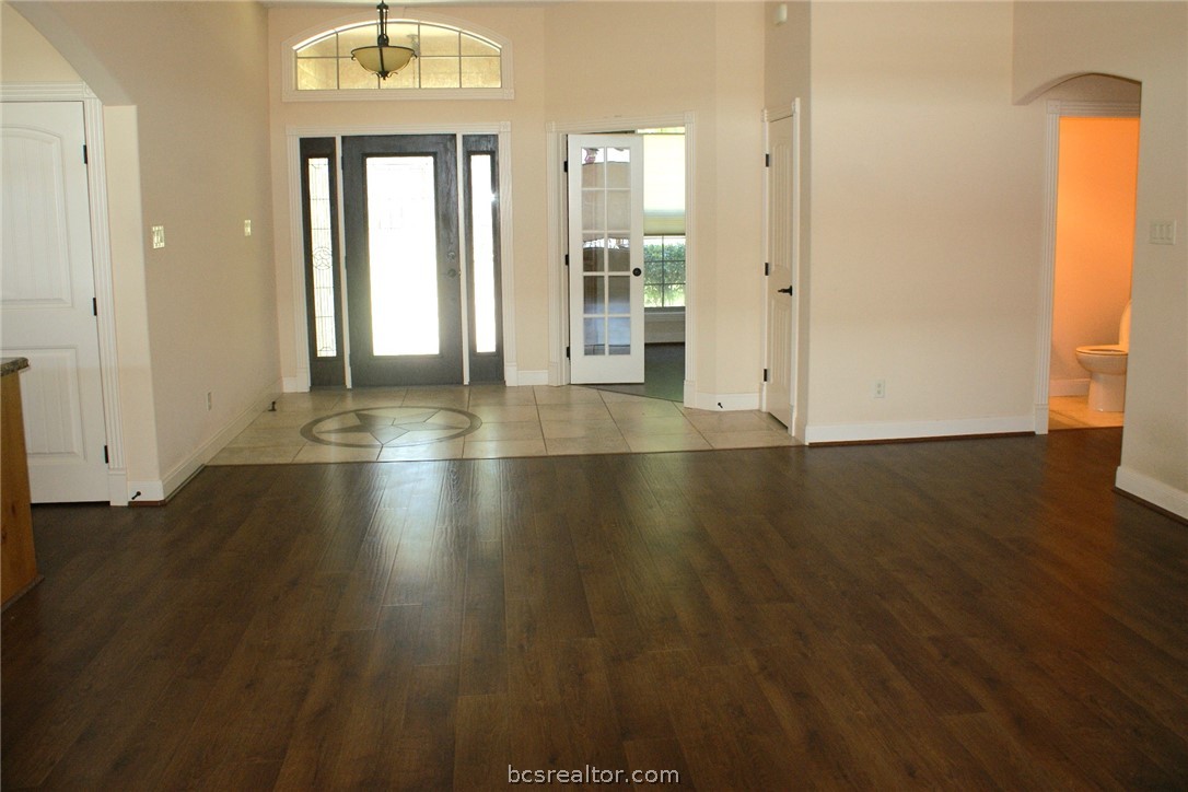 259 Memphis Bell Lane Trinity, TX 75862 - Photo 8 of 50 an empty room with wooden floor and windows