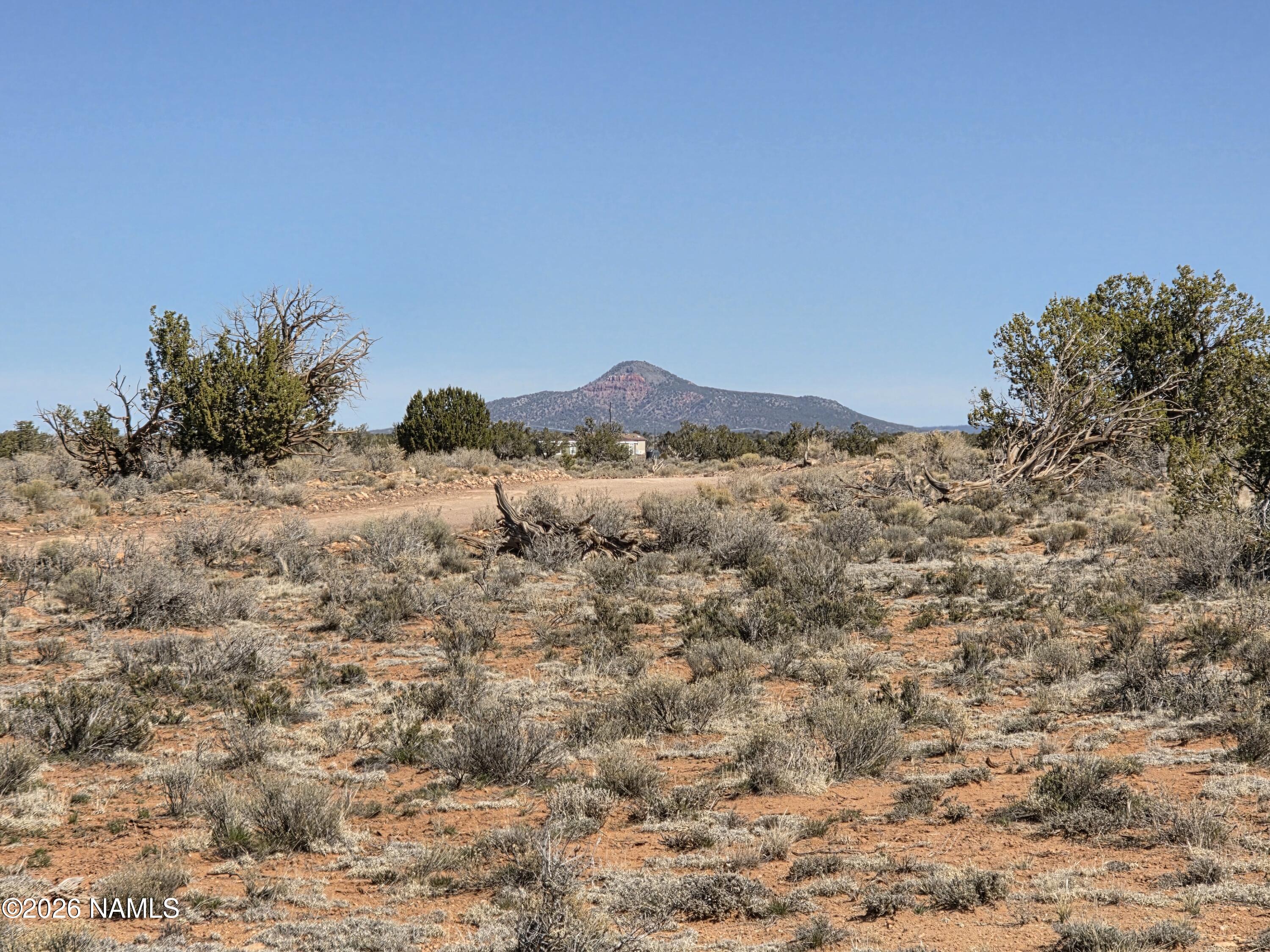 1153 East Indian Meadows Road Williams, AZ 86046 - Photo 9 of 34 a view of a mountain range with a mountain in the background