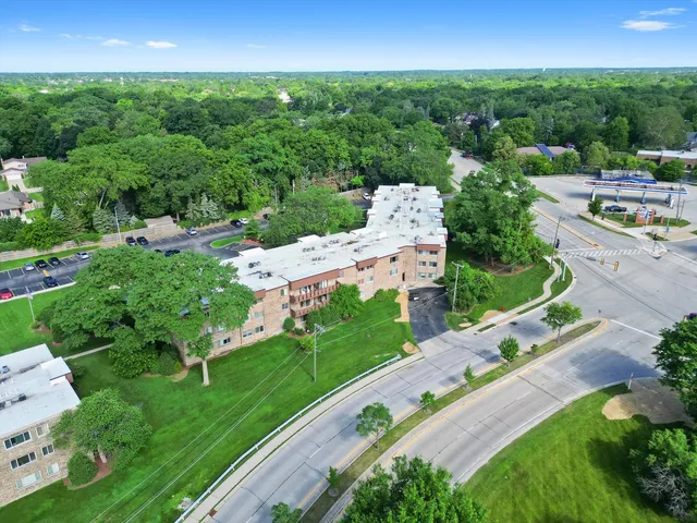 a view of a garden with a building in the background
