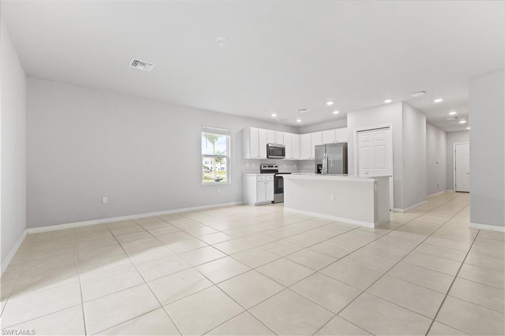 15245 Wildflower Circle Naples, FL 34119 - Photo 13 of 36 a view of a kitchen with a sink