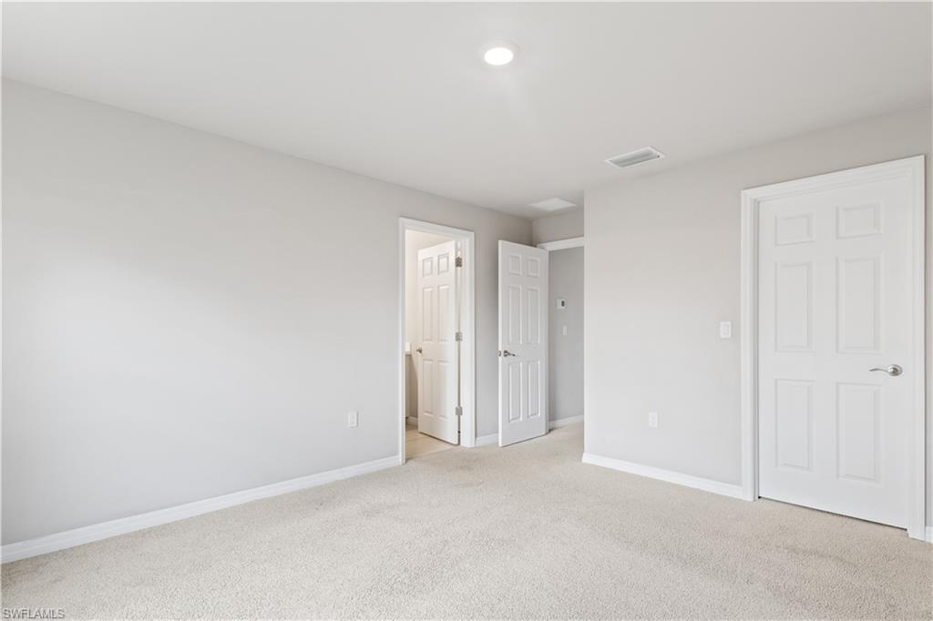 15245 Wildflower Circle Naples, FL 34119 - Photo 17 of 36 a view of an empty room