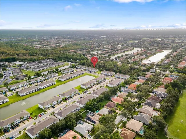 an aerial view of city and lake