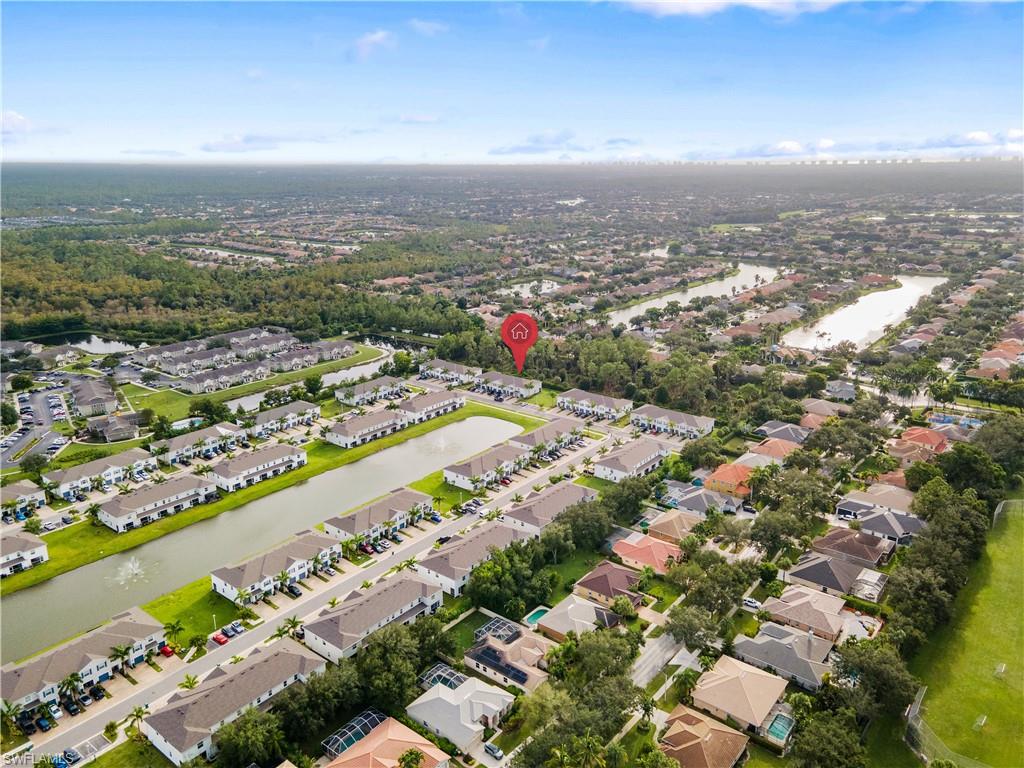 15245 Wildflower Circle Naples, FL 34119 - Photo 2 of 36 an aerial view of city and lake