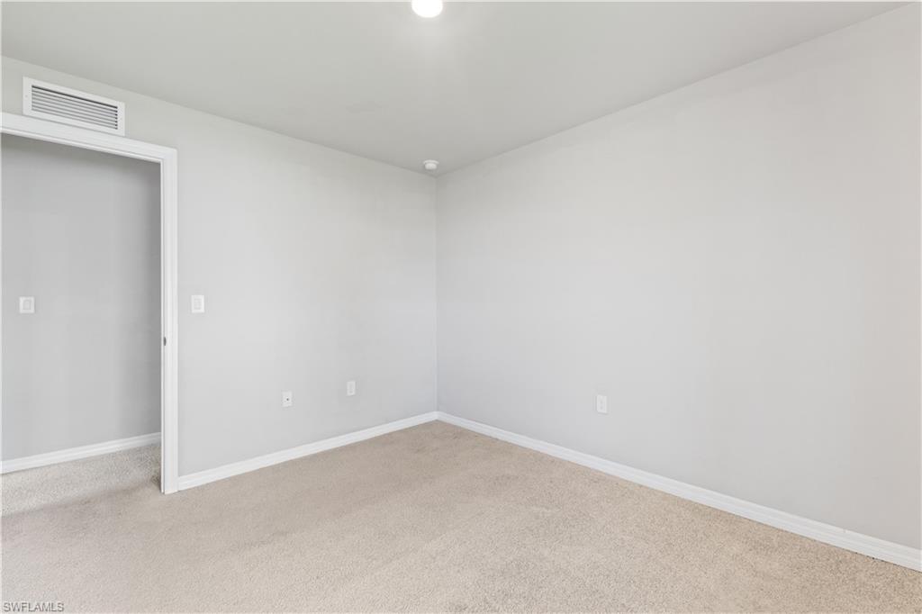 15245 Wildflower Circle Naples, FL 34119 - Photo 25 of 36 a view of an empty room