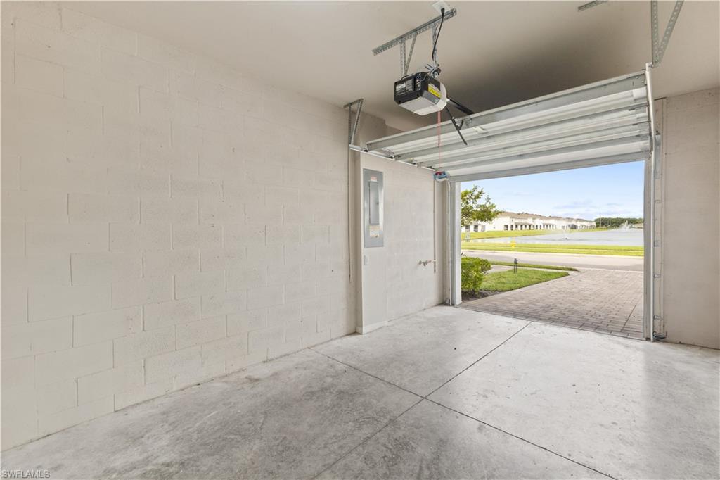 15245 Wildflower Circle Naples, FL 34119 - Photo 26 of 36 a view of a room with a garage