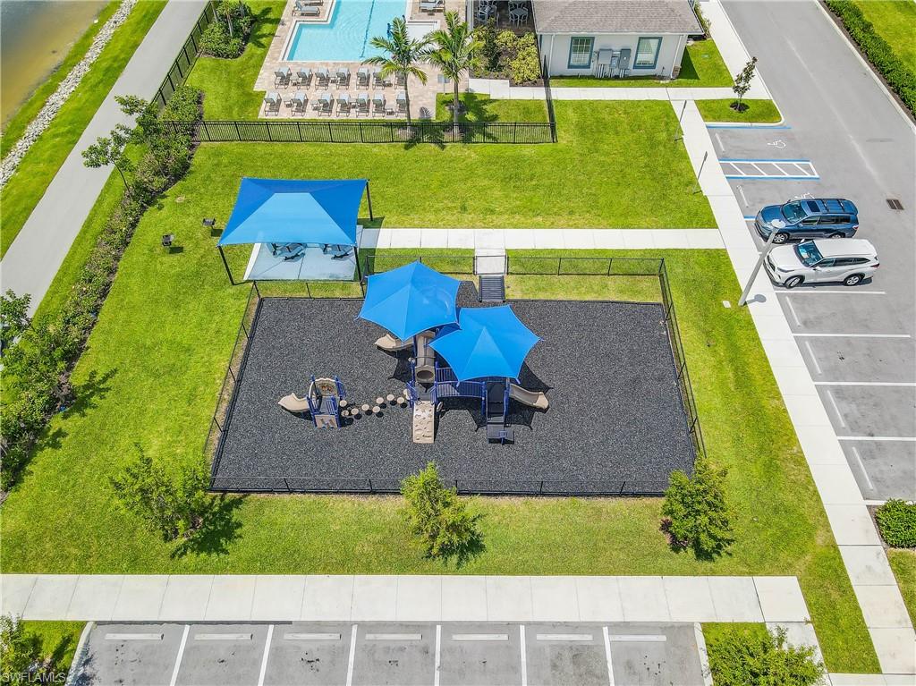 15245 Wildflower Circle Naples, FL 34119 - Photo 29 of 36 an aerial view of a house with a swimming pool