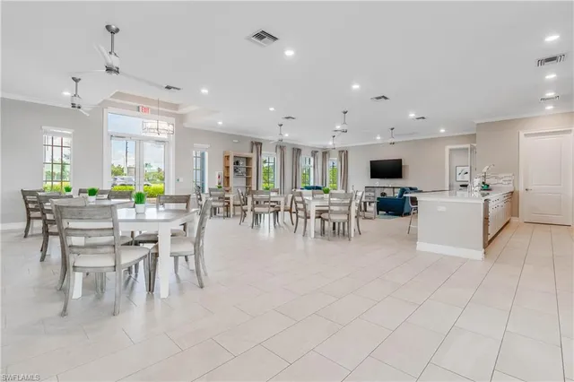 a dining room with furniture a dining table and chairs