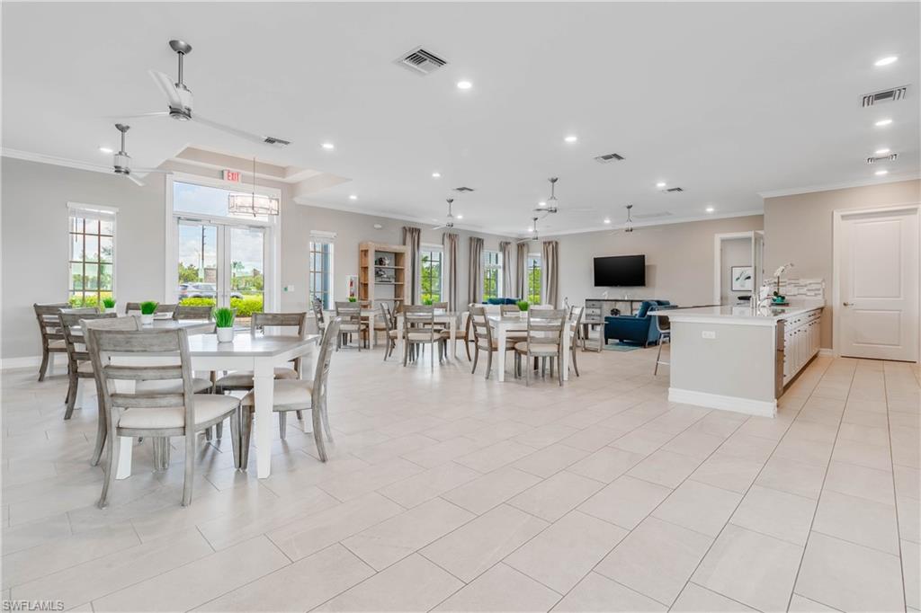 15245 Wildflower Circle Naples, FL 34119 - Photo 36 of 36 a dining room with furniture a dining table and chairs