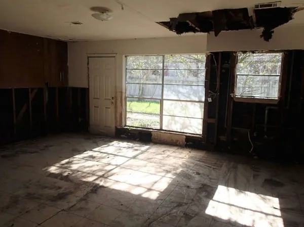 a view of an empty room with a window