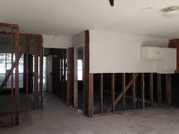 an entryway with a rug