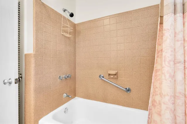 a bathroom with a white bath tub